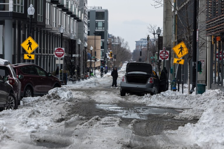 Washington, D.C., residents grapple with poor road conditions caused by a winter storm.