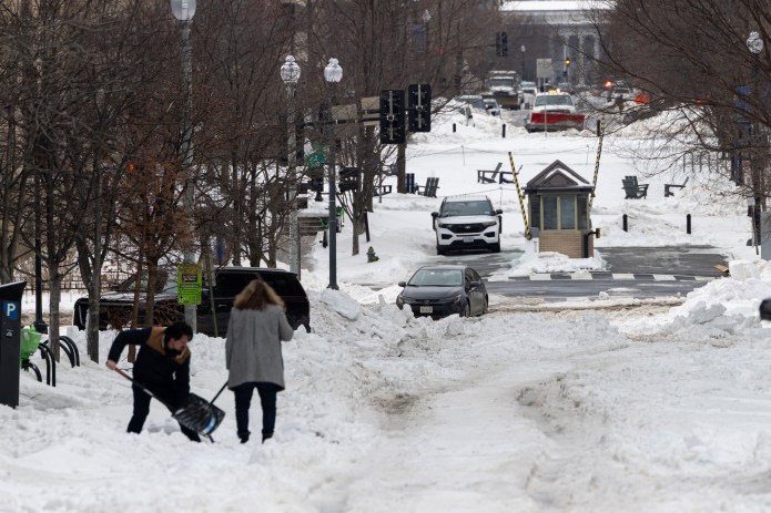 Washington, D.C. residents grapple with poor road conditions caused by winter storm. (Credit: Graeme Jennings)