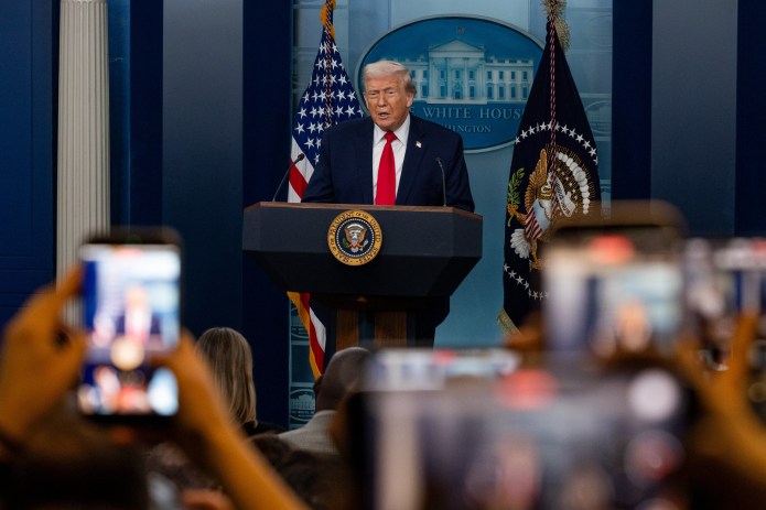 President Donald Trump speaks to the White House press corps on the one year anniversary of his second inauguration