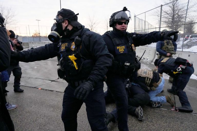 Police officers are seen during protests in Minneapolis.