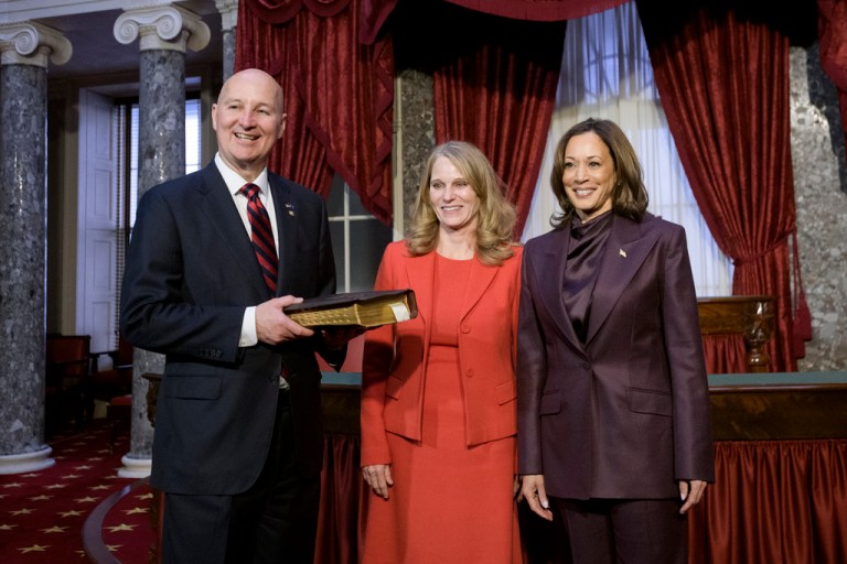 Vice President Kamala Harris, right, poses with Sen. Pete Ricketts, R-Neb., left, and his wife Susanne Shore, center, following a ceremonial swearing-in at the Capitol in Washington, Monday, Dec. 9, 2024. (AP Photo/Rod Lamkey, Jr.)