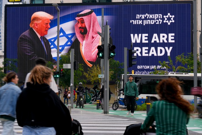 A billboard in Tel Aviv shows Trump and Bin Salman shaking hands
