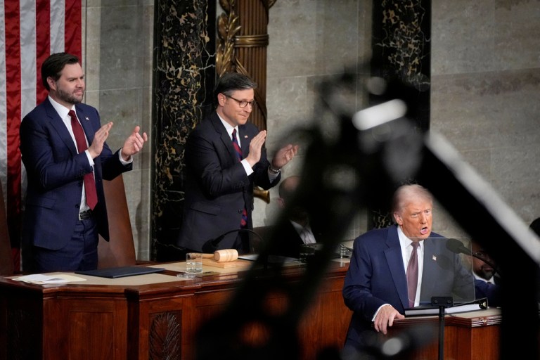 Vice President JD Vance, from left, and House Speaker Mike Johnson, R-La., stand to applaud as President Donald Trump addresses a joint session of Congress at the Capitol in Washington, Tuesday, March 4, 2025
