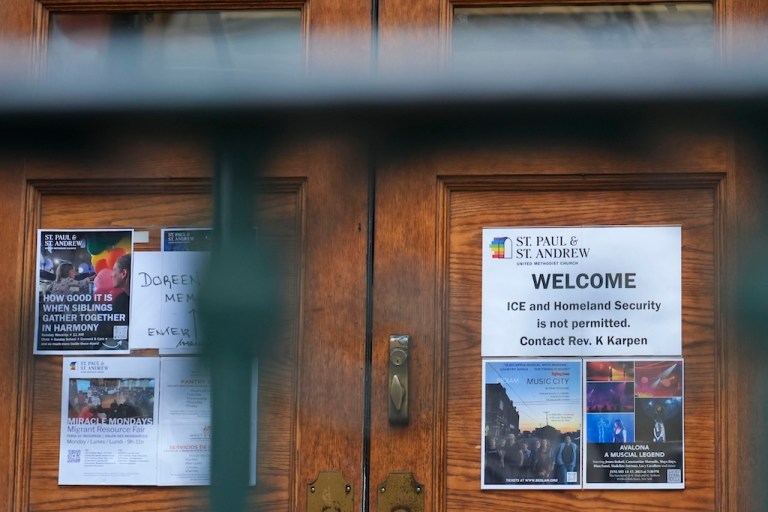 A sign prohibiting the entrance of Immigration and Customs Enforcement or Homeland Security is posted on a door at St. Paul and St. Andrew United Methodist Church.