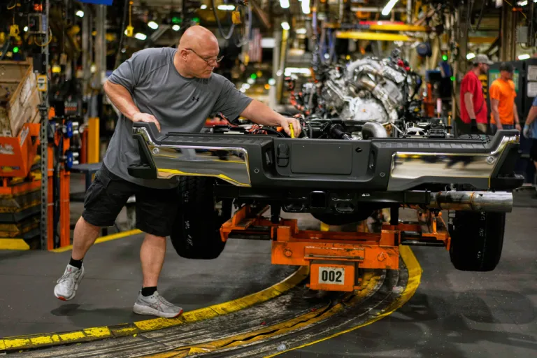 FILE - Vehicle assembly technician Kevin Zepernick works on a 2025 Ford Expedition during a media tour to launch the 2025 Ford Expedition at the Ford Motor Company Kentucky Truck Plant, Wednesday, April 30, 2025, in Louisville, Ky.