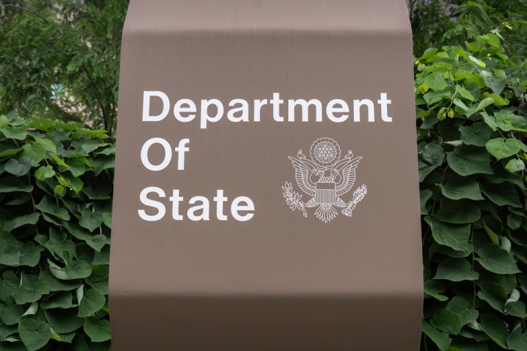 A sign is seen outside the headquarters of the Department of State.