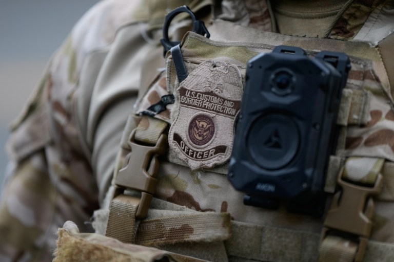 A Customs and Border Protection officer stands outside a U.S. Immigration and Customs Enforcement facility on Saturday, Oct. 4, 2025, in Portland, Ore. (AP Photo/Jenny Kane)