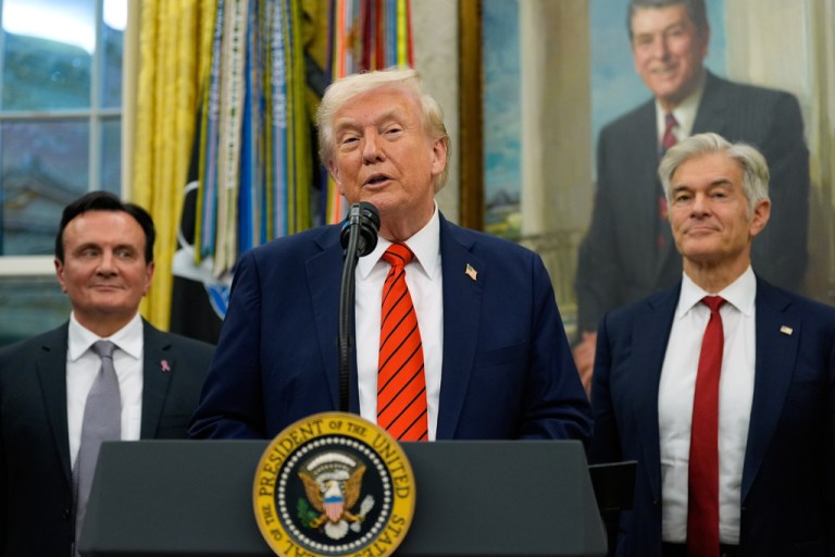 AstraZeneca CEO Pascal Soriot, left, and Centers for Medicare & Medicaid Services administrator Dr. Mehmet Oz listen as President Donald Trump speaks in the Oval Office of the White House, Friday, Oct. 10, 2025, in Washington. (AP Photo/Alex Brandon)