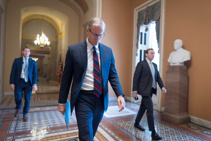 Senate Majority Leader , R-S.D., heads to a closed-door meeting with fellow Republicans at the Capitol in Washington, Tuesday, Dec. 9, 2025. (AP Photo/J. Scott Applewhite)