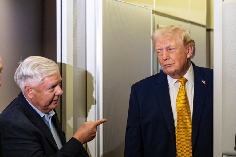 President Donald Trump, accompanied by Sen. Lindsey Graham, R-S.C., speaks with reporters while in flight on Air Force One, Sunday, Jan. 4, 2026, as they were returning to Joint Base Andrews, Md.