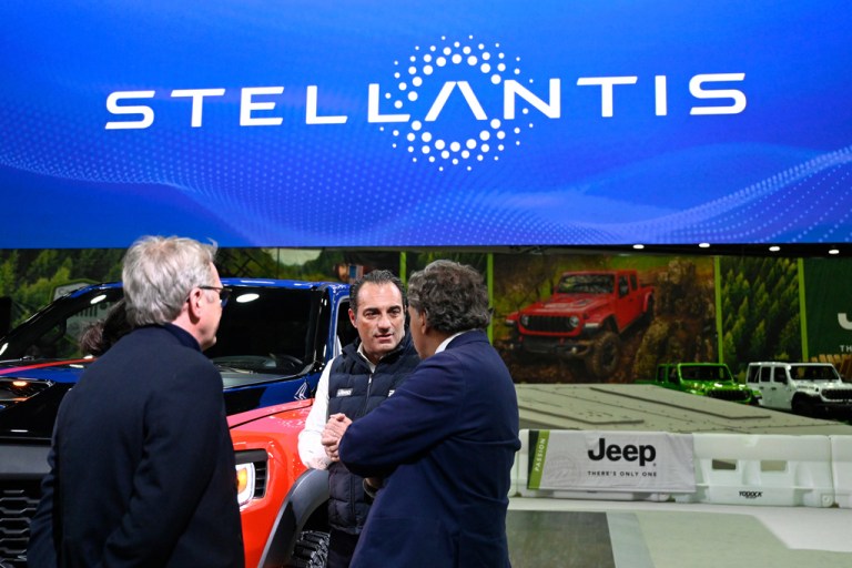 Stellantis CEO and Executive Director Antonio Filosa talks with guests at the Detroit Auto Show.