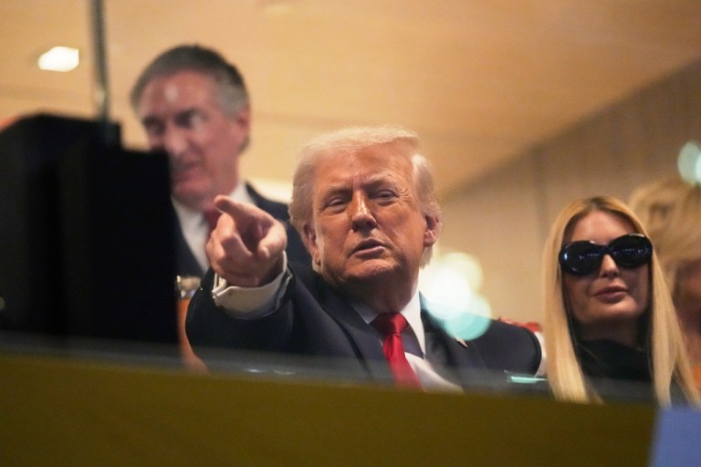President Donald Trump watches first half of the College Football Playoff national championship game between Miami and Indiana, Monday, Jan. 19, 2026, in Miami Gardens, Fla.
