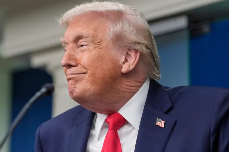 President Donald Trump smiles as he takes questions from reporters in the James Brady Press Briefing Room at the White House, Tuesday, Jan. 20, 2026, in Washington.