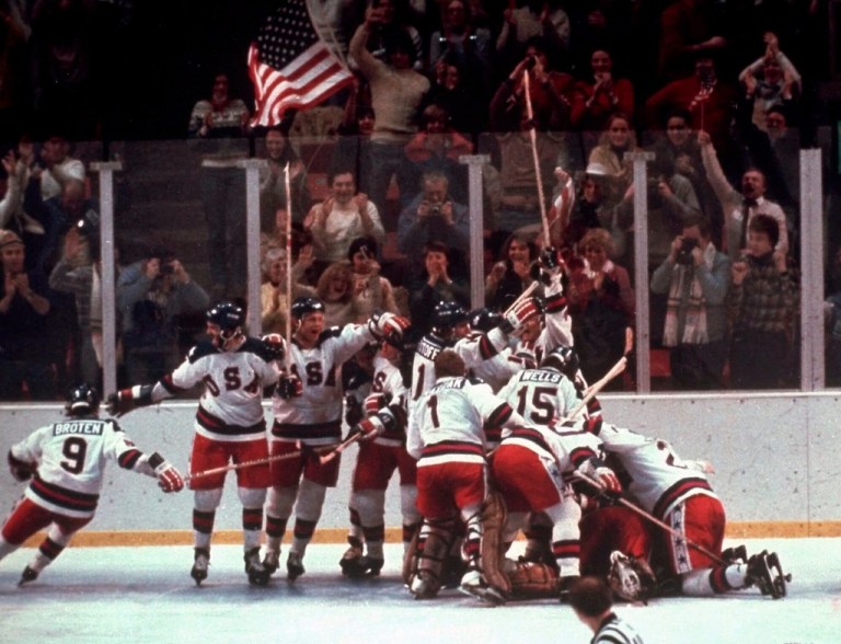 The U.S. hockey team pounces on goalie Jim Craig after a 4-3 victory against the Soviet Union in a medal round match at the the 1980 Winter Olympics.