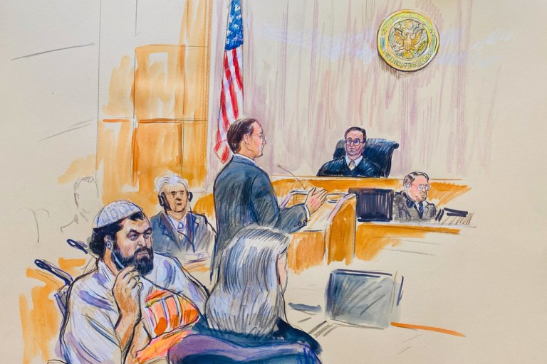 This courtroom sketch depicts Rahmanullah Lakanwal, 29, seated left, with defense attorney Michelle Peterson, seated foreground, before U.S. District Judge Amit Mehta, Wednesday, Feb. 4, 2025 at Federal Court in Washington, as Assistant U.S. Attorney Christopher Tortorice speaks at the podium.