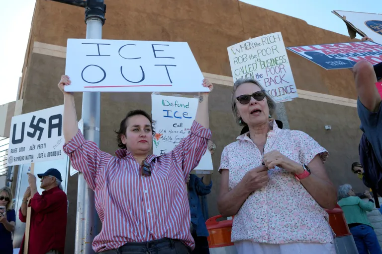 People gather during a protest against immigration enforcement operations.