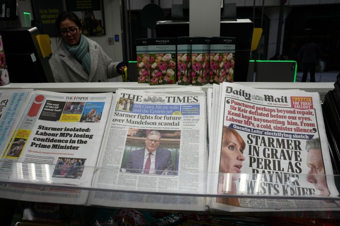 Newspapers on sale show headlines relating to the Epstein files in London.