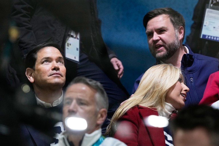 Vice President JD Vance, right, and Secretary of State Marco Rubio, left, attend a preliminary round match of women's ice hockey