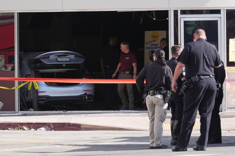 A car is seen inside of a 99 Ranch Market at the scene of a fatal crash Thursday, Feb. 5, 2026, in the Westwood neighborhood of Los Angeles.(AP Photo/Damian Dovarganes)