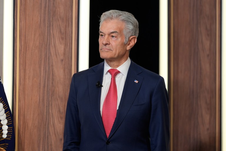 Centers for Medicare and Medicaid Services administrator Dr. Mehmet Oz listens as President Donald Trump speaks about TrumpRx in the South Court Auditorium in the Old Eisenhower Executive Office Building on the White House campus, Thursday, Feb. 5, 2026, in Washington.