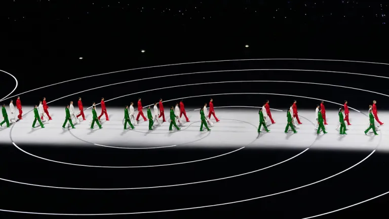 Artists wearing Italian colors perform during the Olympic opening ceremony at the 2026 Winter Olympics, in Milan, Italy, Friday, Feb. 6, 2026. (AP Photo/Petr David Josek)