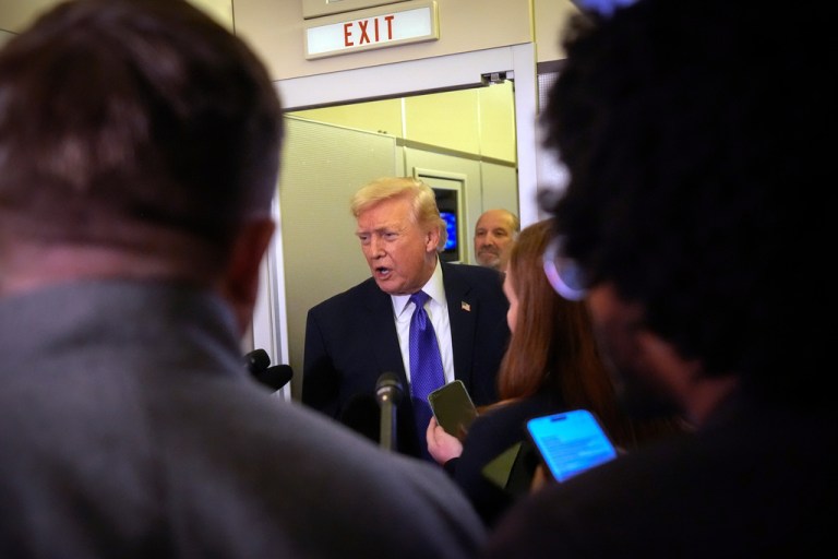 President Donald Trump speaks to reporters as he flies aboard Air Force One from Joint Base Andrews, Md., to West Palm Beach, Fla., Friday, Feb. 6, 2026.