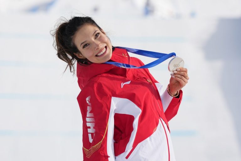 China's Eileen Gu poses with her silver medal.
