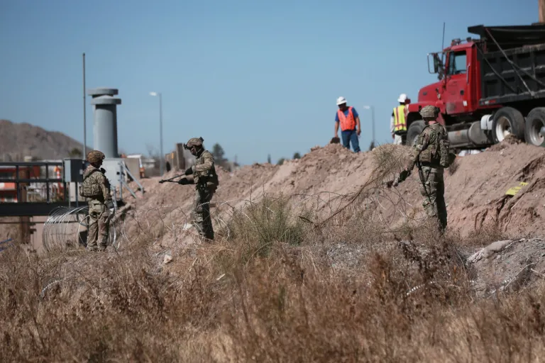 Security forces install barbed wire along the U.S. border in Ciudad Juarez, Mexico