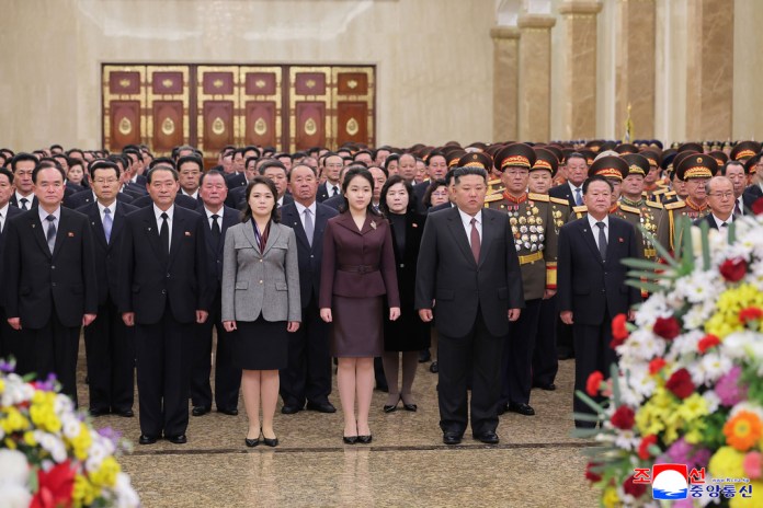 Kim Jong Un stands shoulder to shoulder with his daughter and his wife