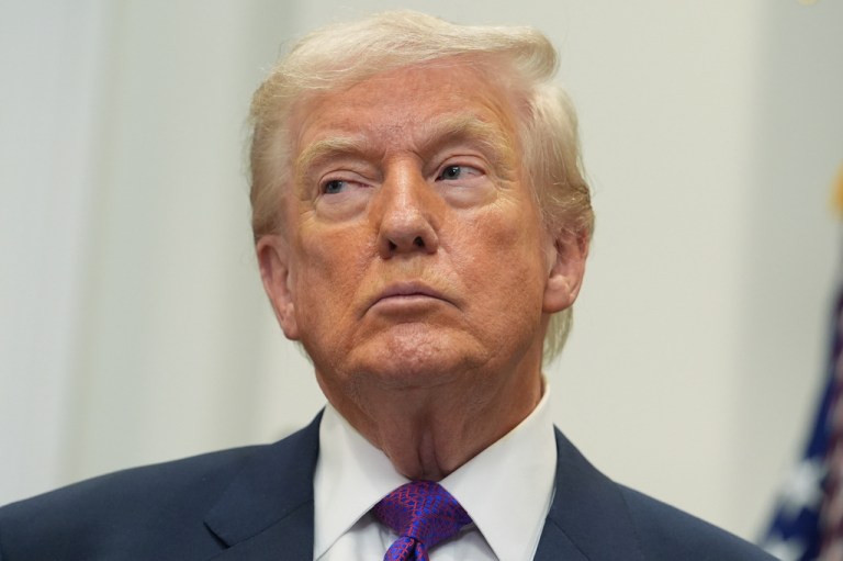 President Donald Trump listens as Environmental Protection Agency director Lee Zeldin speaks