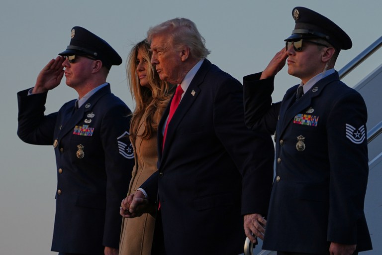 President Donald Trump and first lady Melania Trump deplane Air Force One.