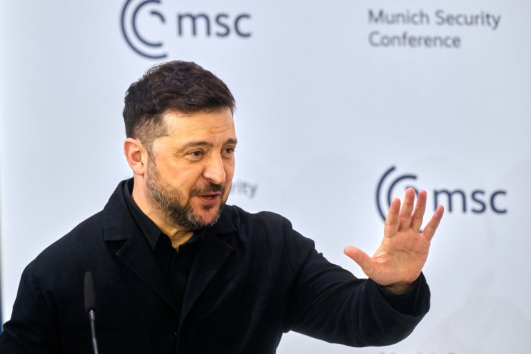Ukraine's President Volodymyr Zelenskyy waves as he prepares to address the audience during a session at the Munich Security Conference in Munich, Germany, Saturday, Feb. 14, 2026.