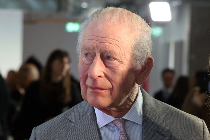 Britain's King Charles III reacts during an exhibition celebrating sustainable British innovation as he opens London Fashion Week 2026, at 180 Studios, central London, Thursday Feb. 19, 2026. 