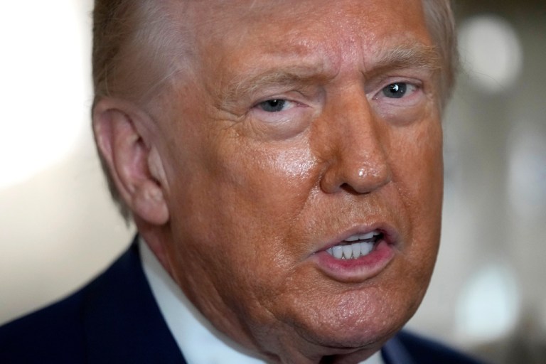 President Donald Trump speaks to reporters aboard Air Force One shortly before takeoff, Thursday, Feb. 19, 2026, at Joint Base Andrews, Md.