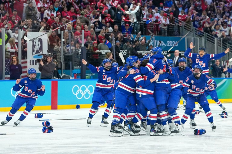 United States' players celebrate after a women's ice hockey gold medal game between the United States and Canada at the 2026 Winter Olympics, in Milan, Italy, Thursday, Feb. 19, 2026. (AP Photo/Petr David Josek)