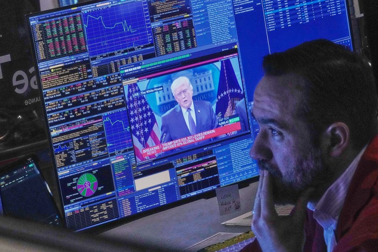 President Donald Trump appears on trader Robert Greason's screen.