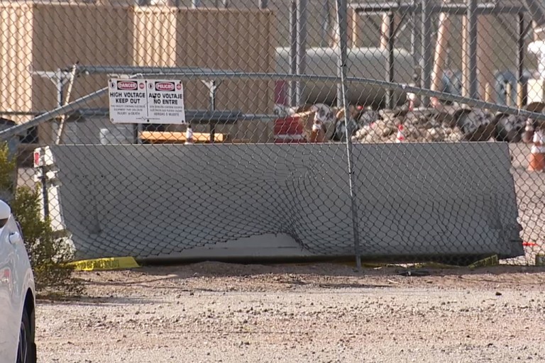 This photo provided by KTNV shows damage to a fence outside a power substation, where authorities say they are investigating a car collision, on Thursday, Feb. 19, 2026, in Boulder City, Nevada.