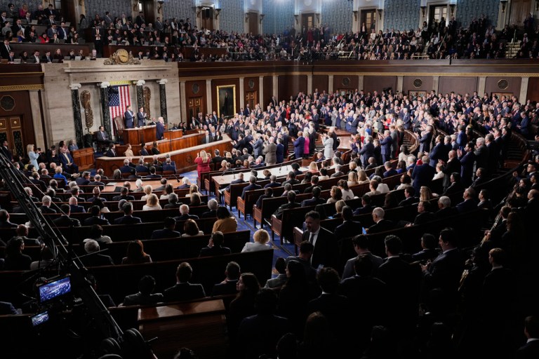 Republican members of Congress stand while Democrats keep their seats during President Donald Trump's State of the Union address to a joint session of Congress in the House chamber at the U.S. Capitol in Washington, Tuesday, Feb. 24, 2026.