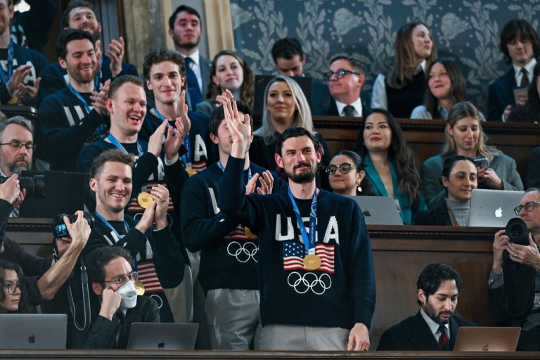 Members of the United States Olympic gold medal hockey team enter the gallery as President Donald Trump delivers the State of the Union address to a joint session of Congress