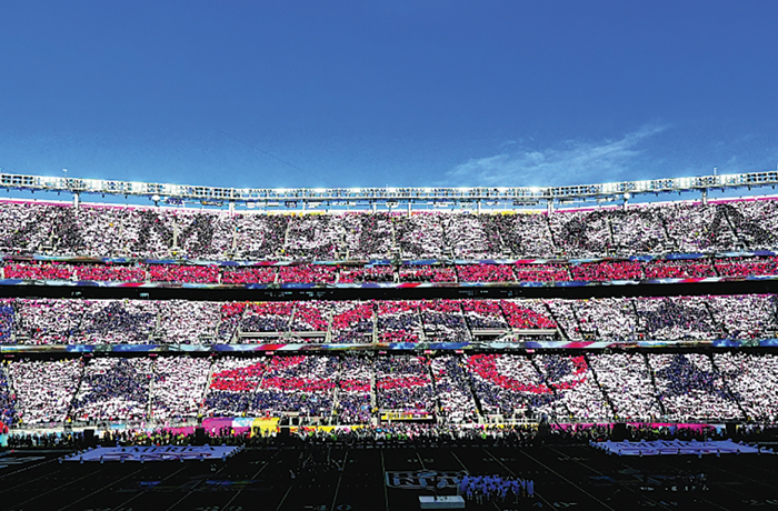 Fans use placards to display ‘America 250’ prior to the start of Super Bowl 60 on Feb. 8 in Santa Clara, California. (Thearon W. Henderson/Getty Images)
