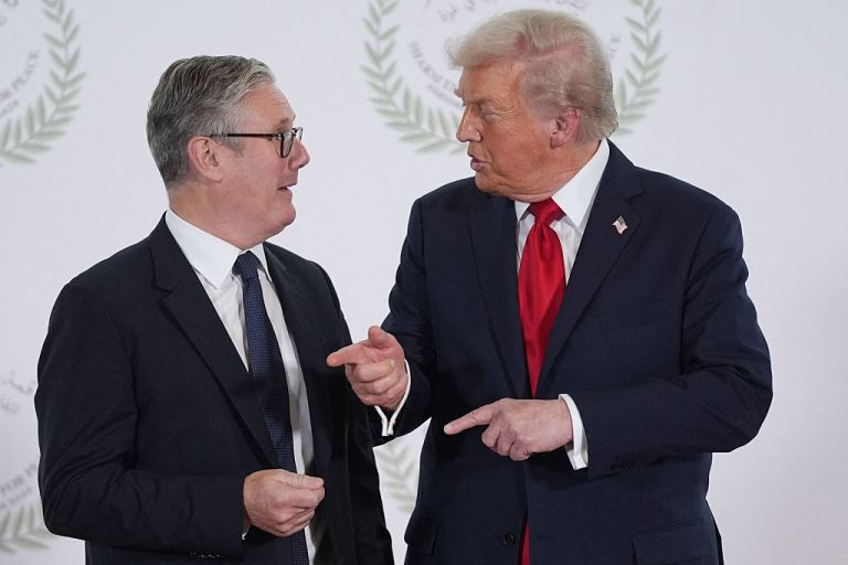 US President Donald Trump greets Britain's Prime Minister Keir Starmer during a summit on Gaza in Sharm el-Sheikh on October 13, 2025. Trump landed in Egypt on October 13 for a summit on Gaza, following a lightning visit to Israel after a ceasefire he brokered entered into force. (Photo by Evan Vucci / POOL / AFP) (Photo by EVAN VUCCI/POOL/AFP via Getty Images)