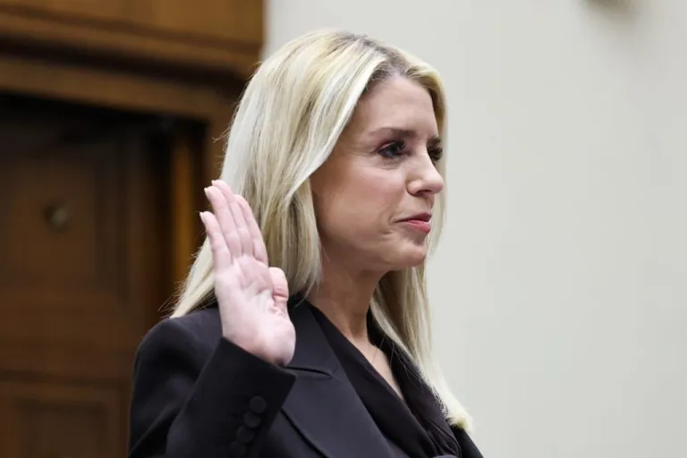 Pam Bondi taking an oath before giving testimony.