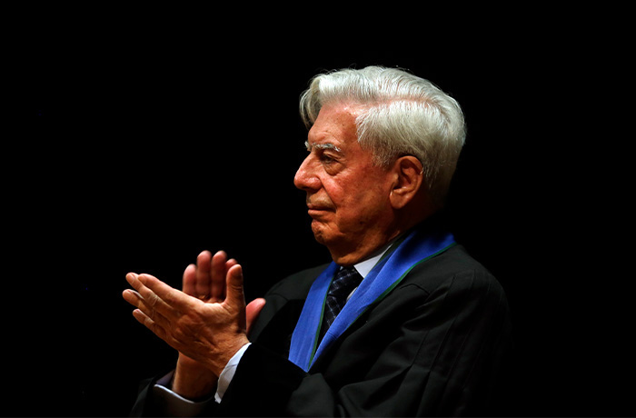 Peru's Nobel Literature Prize laureate Mario Vargas Llosa applauds during a ceremony after being awarded an Honoris Causa degree by Lisbon Nova university, Tuesday, July 22, 2014, in Lisbon. (Francisco Seco/AP)