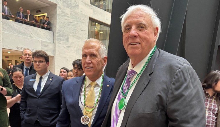 Sen. Jim Justice (R-WV) stands with Sen. Thom Tillis (R-NC), who hosted the final dog parade of his Senate career on Wednesday on Capitol Hill. (David Sivak/Washington Examiner)
