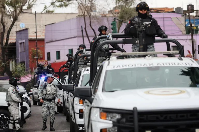 National Guards patrol the area outside of the General Prosecutor's headquarters in Mexico City, Sunday, Feb. 22, 2026, after authorities reported that the Mexican Army killed Jalisco New Generation Cartel leader Nemesio Oseguera, known as 