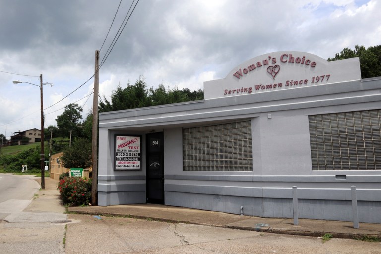 A sign advertises free pregnancy tests and abortion information outside the Woman's Choice Pregnancy Resource Center.