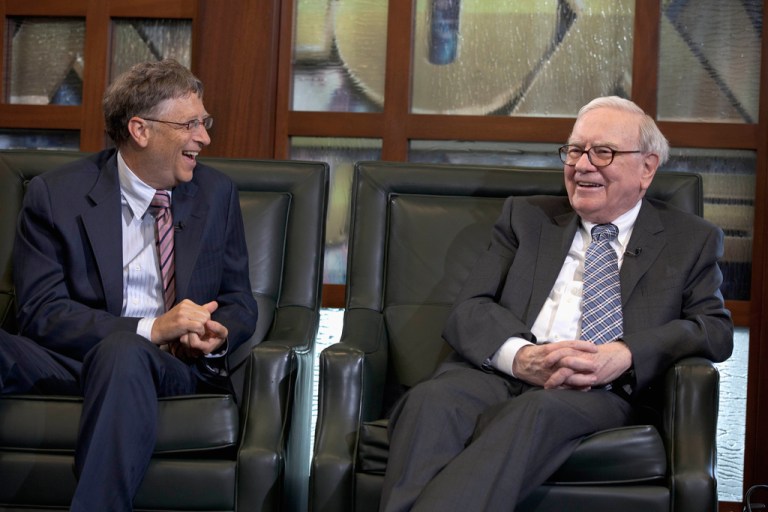 Warren Buffett, chairman and CEO of Berkshire Hathaway, right, looks at Microsoft founder and Berkshire board member Bill Gates during an interview with Liz Claman of the Fox Business Network in Omaha, Neb., May 7, 2012. Buffett announced another $5.3 billion in charitable gifts Friday, June 28, 2024, but in a major shift of his longtime giving plan, he says he plans to cut off donations to the Bill & Melinda Gates Foundation after his death and let his three children decide how to distribute the rest of his $128 billion fortune.