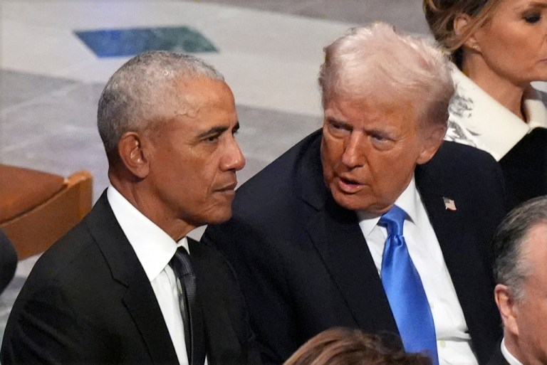 Former President Barack Obama talks with President-elect Donald Trump.