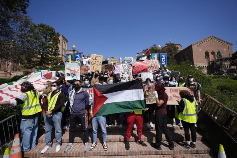 Demonstrators gather on the UCLA campus after nighttime clashes between pro-Israel and pro-Palestinian groups, May 1, 2024.