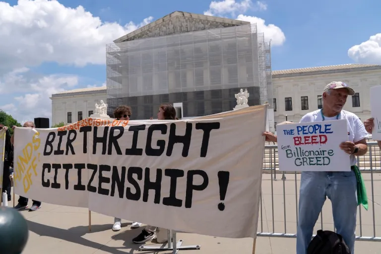 Demonstrators hold up a banner during a citizenship rally outside of the Supreme Court in Washington, May 15, 2025. (AP Photo/Jose Luis Magana, File)